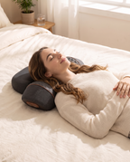 Woman resting in bed with her neck on the ArchRest and her head on its built-in head pad