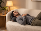 Man relaxing on the sofa with his neck resting on the ArchRest
